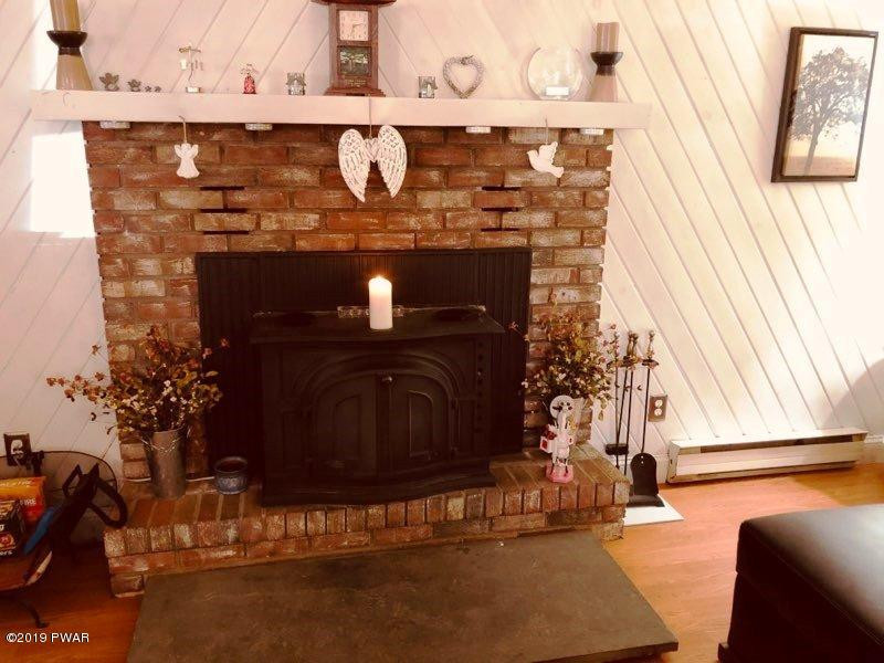 148 Roundhill Road Dingmans Ferry, PA 18328 - Photo 3 of 24 a room with fireplace