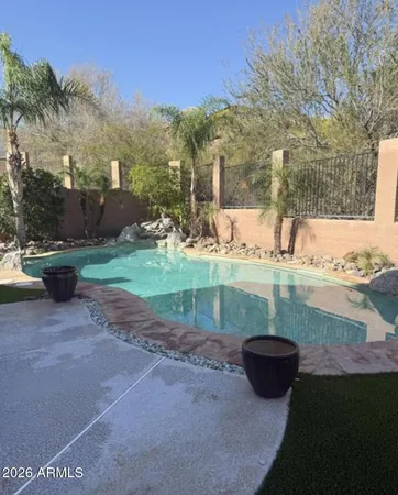a view of a backyard of the house