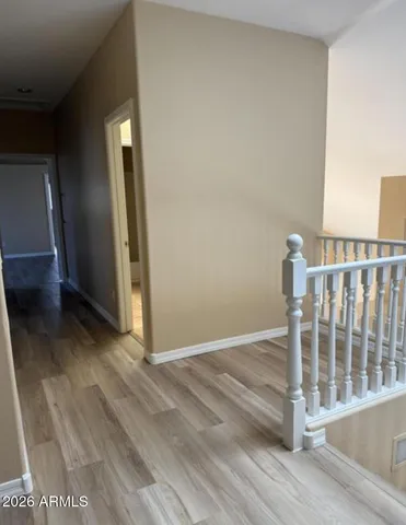 a view of entryway with wooden floor