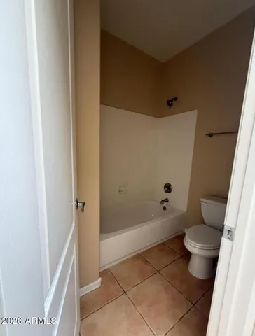 a bathroom with a shower and a toilet