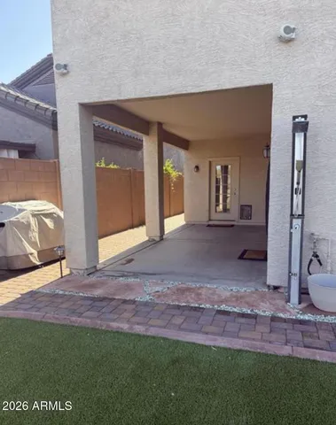 a view of front door with a chair