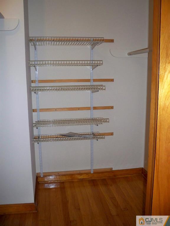 111 Kimberly Road Colonia, NJ 07067 - Photo 12 of 18 a view of a room with empty racks