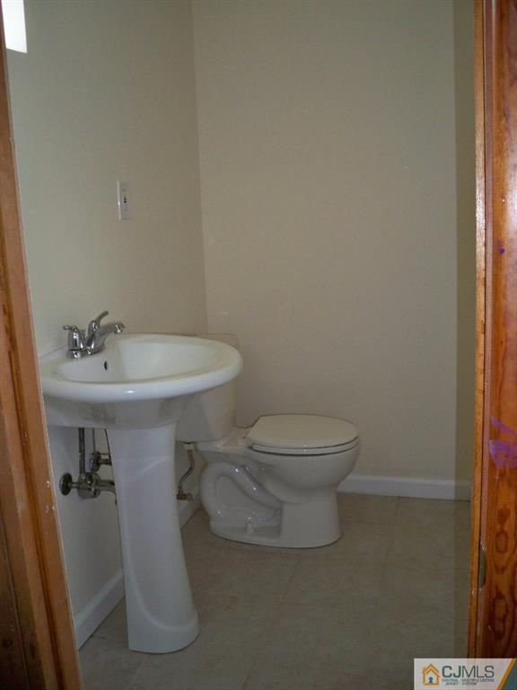 111 Kimberly Road Colonia, NJ 07067 - Photo 16 of 18 a bathroom with a sink toilet and a mirror