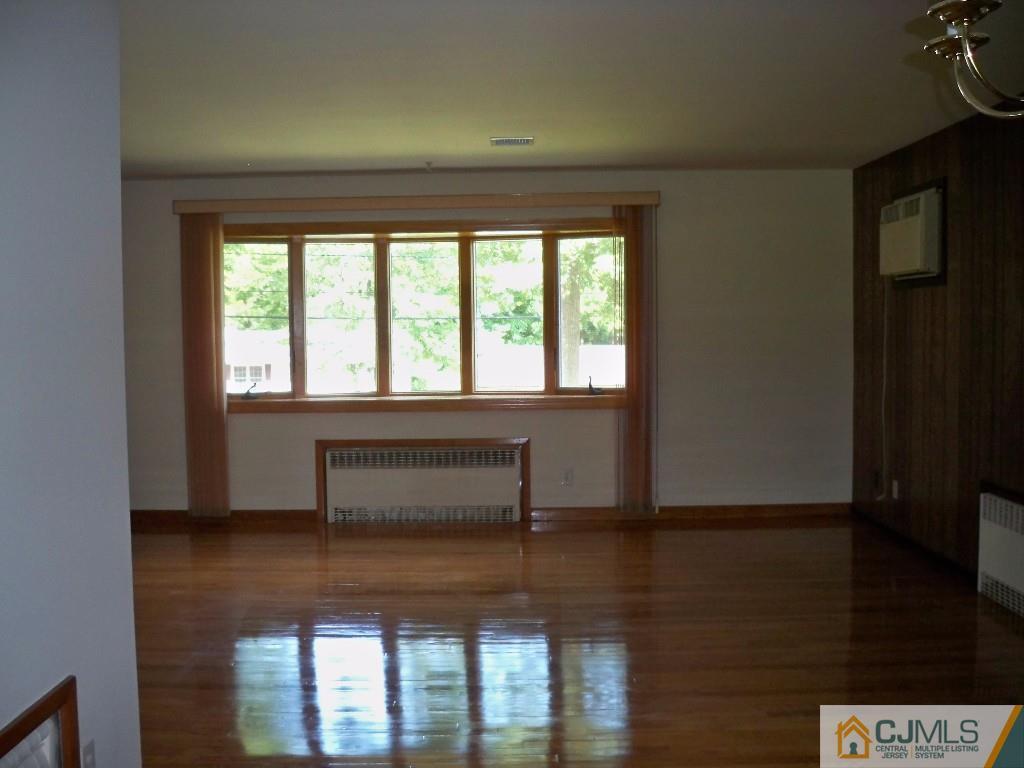 111 Kimberly Road Colonia, NJ 07067 - Photo 4 of 18 a living room with furniture and a window