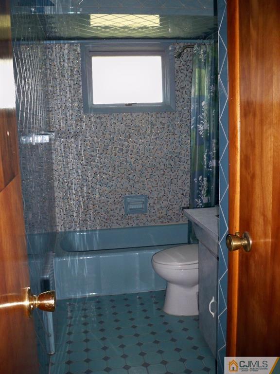 111 Kimberly Road Colonia, NJ 07067 - Photo 8 of 18 a bathroom with a toilet and a shower