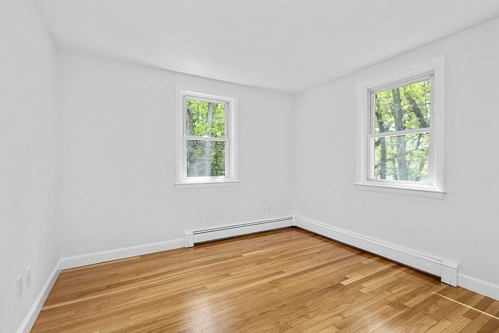 117 Oak Ridge Drive Ayer, MA 01432 - Photo 15 of 26 an empty room with a window