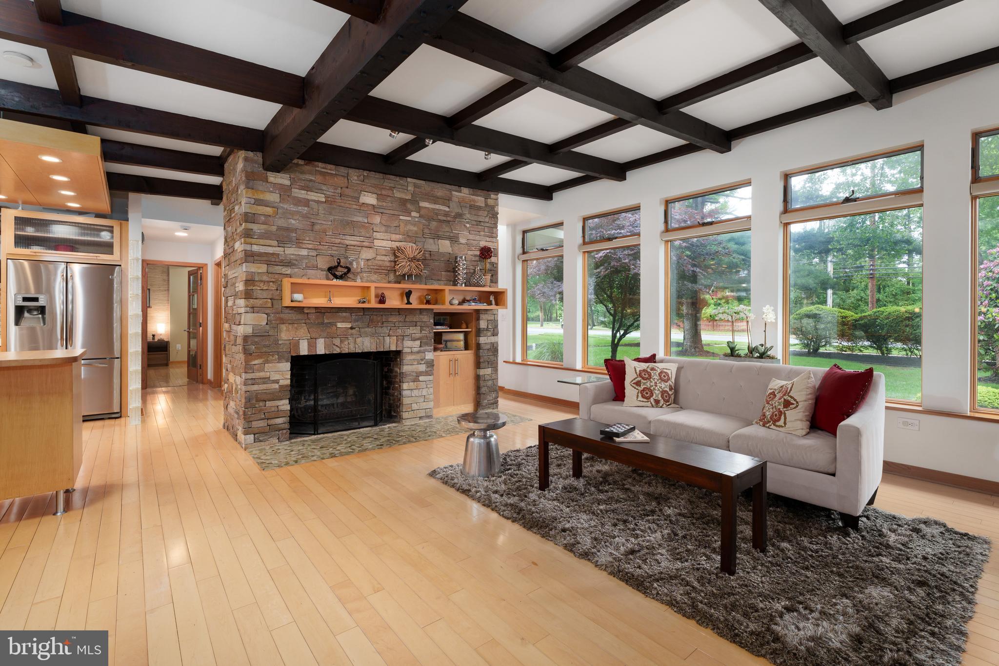 319 Clarksville Road Princeton Junction, NJ 08550 - Photo 12 of 41 a living room with furniture a fireplace and a table