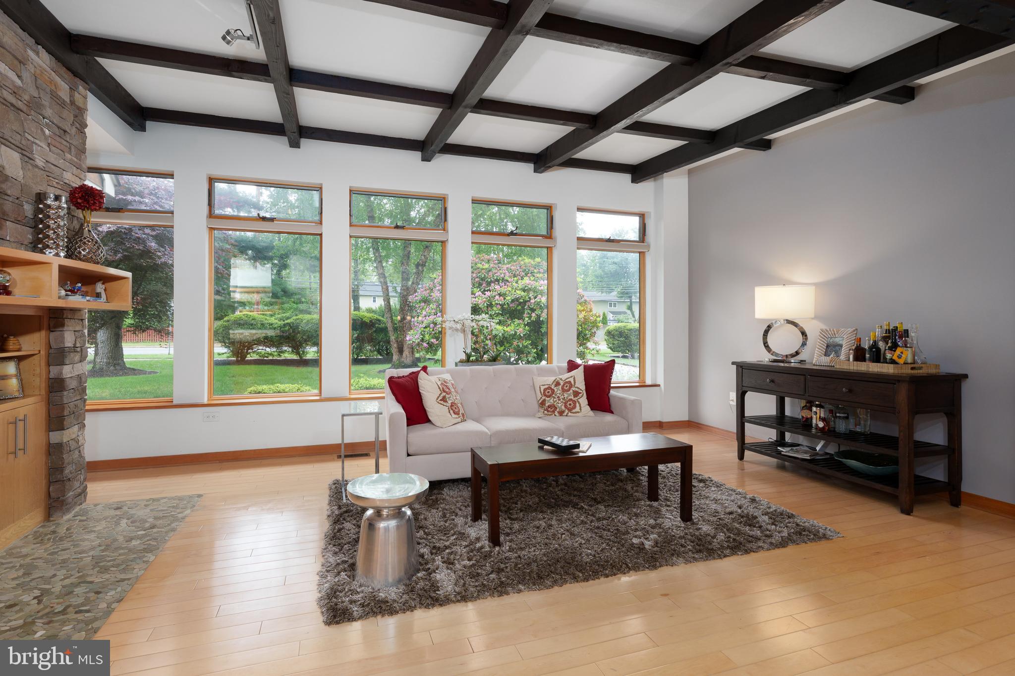 319 Clarksville Road Princeton Junction, NJ 08550 - Photo 15 of 41 a living room with furniture a fireplace and a table