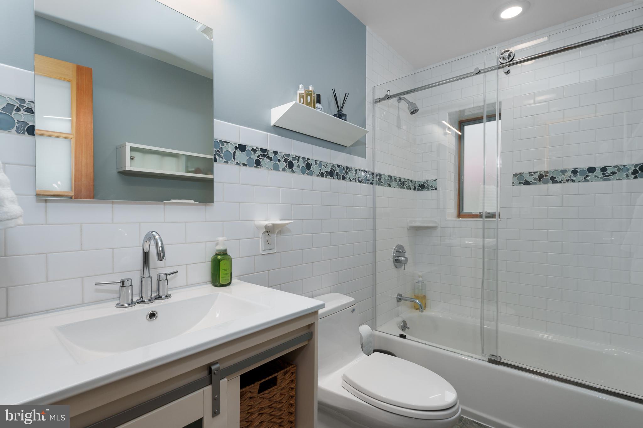 319 Clarksville Road Princeton Junction, NJ 08550 - Photo 32 of 41 a bathroom with a sink toilet a mirror and shower