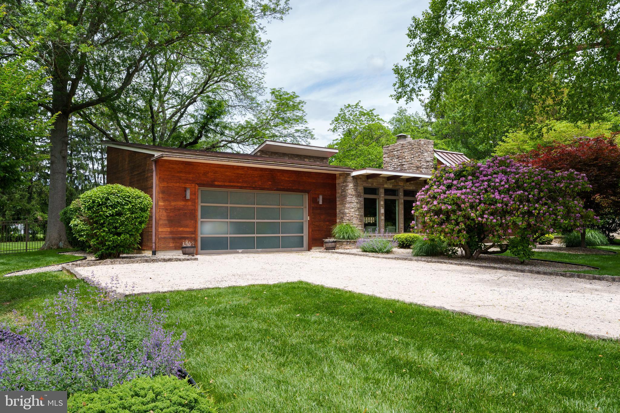 319 Clarksville Road Princeton Junction, NJ 08550 - Photo 5 of 41 a front view of a house with a yard and garage