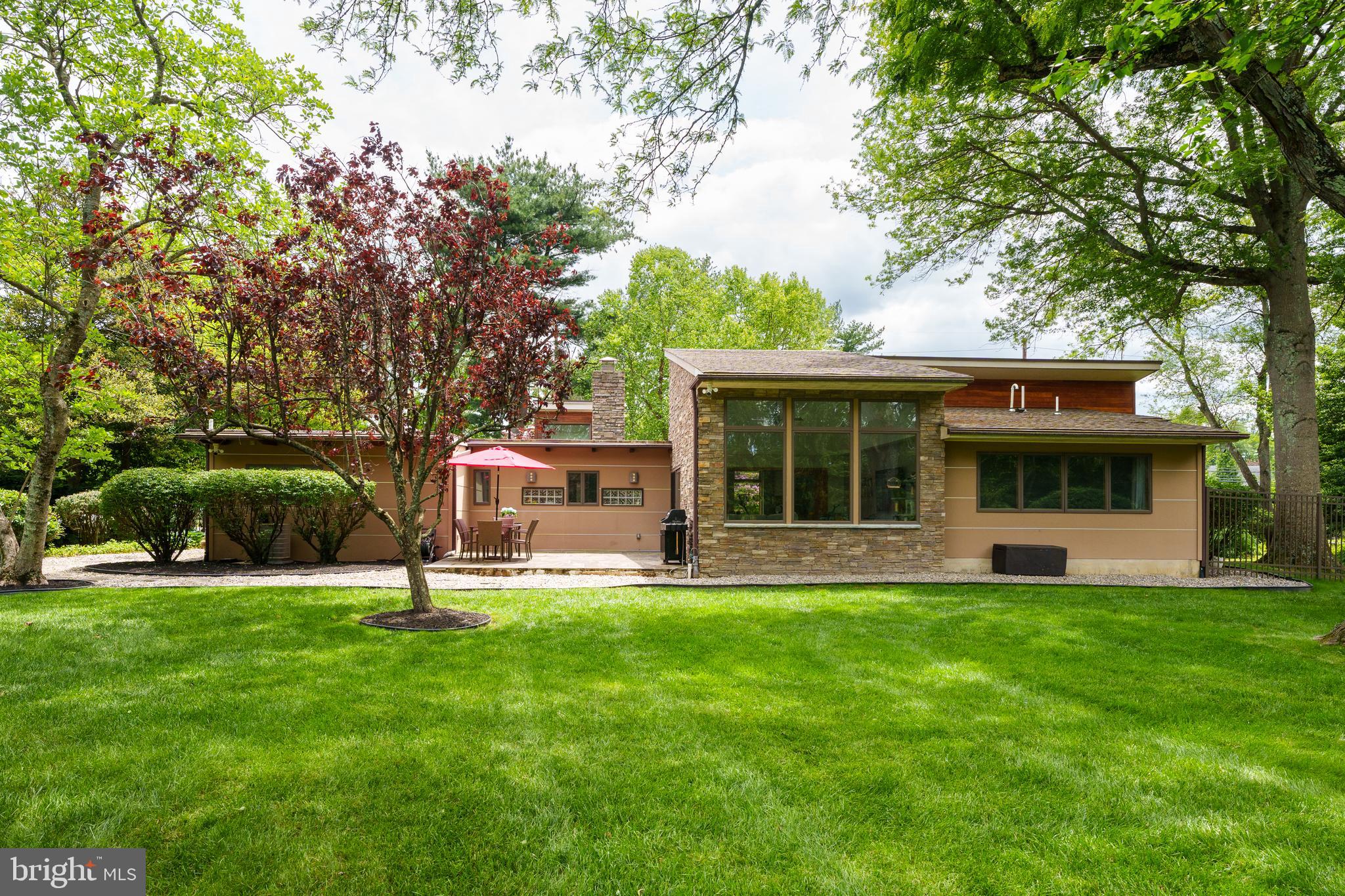 319 Clarksville Road Princeton Junction, NJ 08550 - Photo 6 of 41 a view of a house with a yard and sitting area