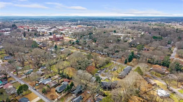 an aerial view of multiple house with yard