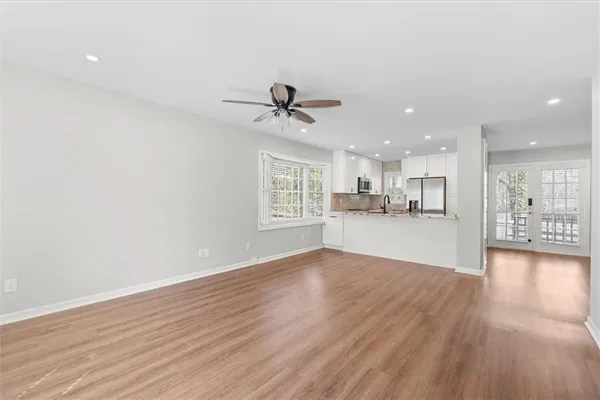 a view of a kitchen with a sink and a window