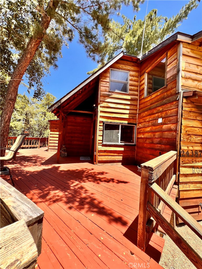 24387 Rocky Point Road Idyllwild, CA 92549 - Photo 10 of 29 a backyard of a house with yard and garage