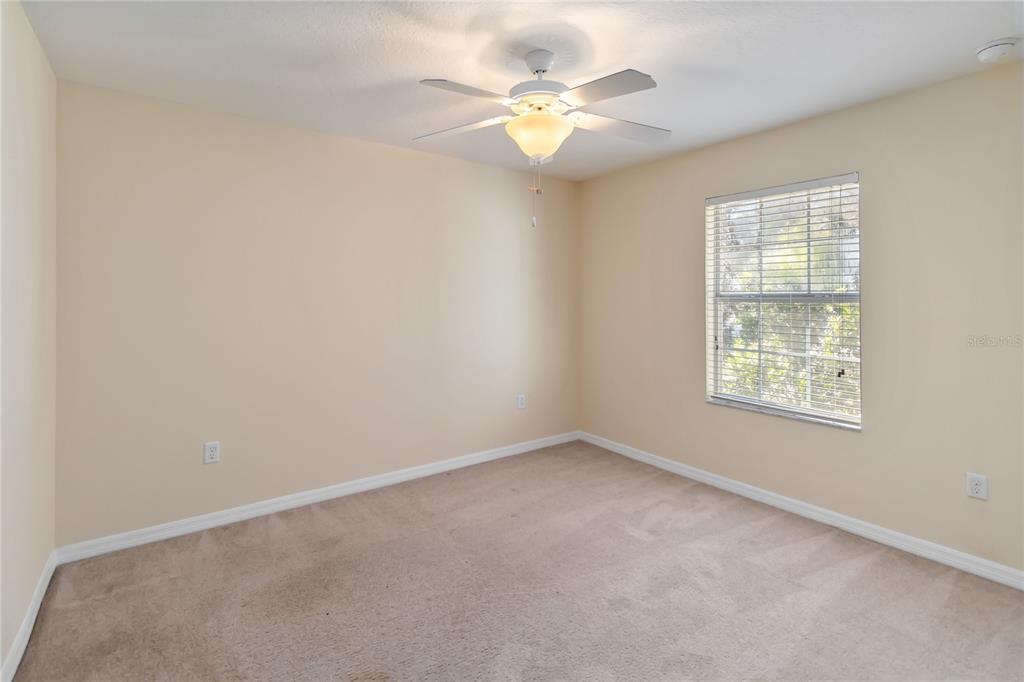 1379 Vasey Road Apopka, FL 32703 - Photo 15 of 21 an empty room with a window and a fan