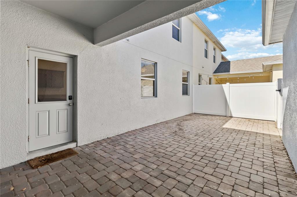 1379 Vasey Road Apopka, FL 32703 - Photo 20 of 21 a view of a big room with wooden floor and windows