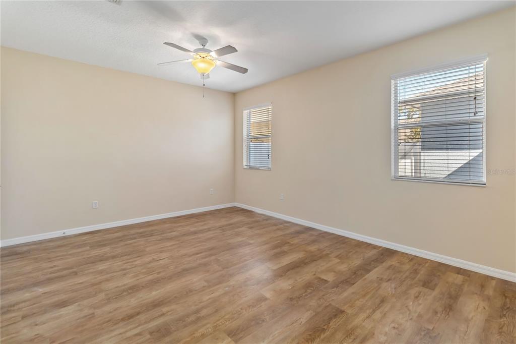 1379 Vasey Road Apopka, FL 32703 - Photo 9 of 21 a view of an empty room with chandelier fan and a window
