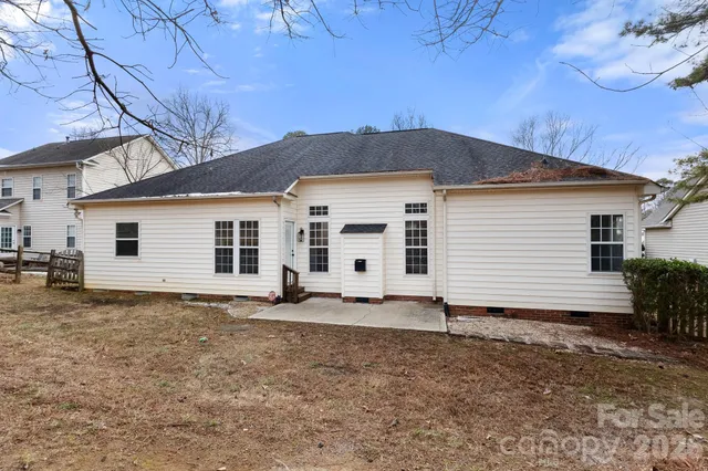 a backyard of a house with lots of green space