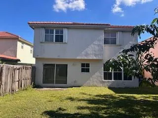 a house with yard in front of it