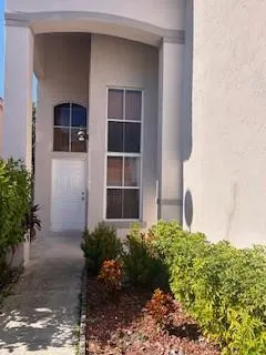 a house view with a garden space