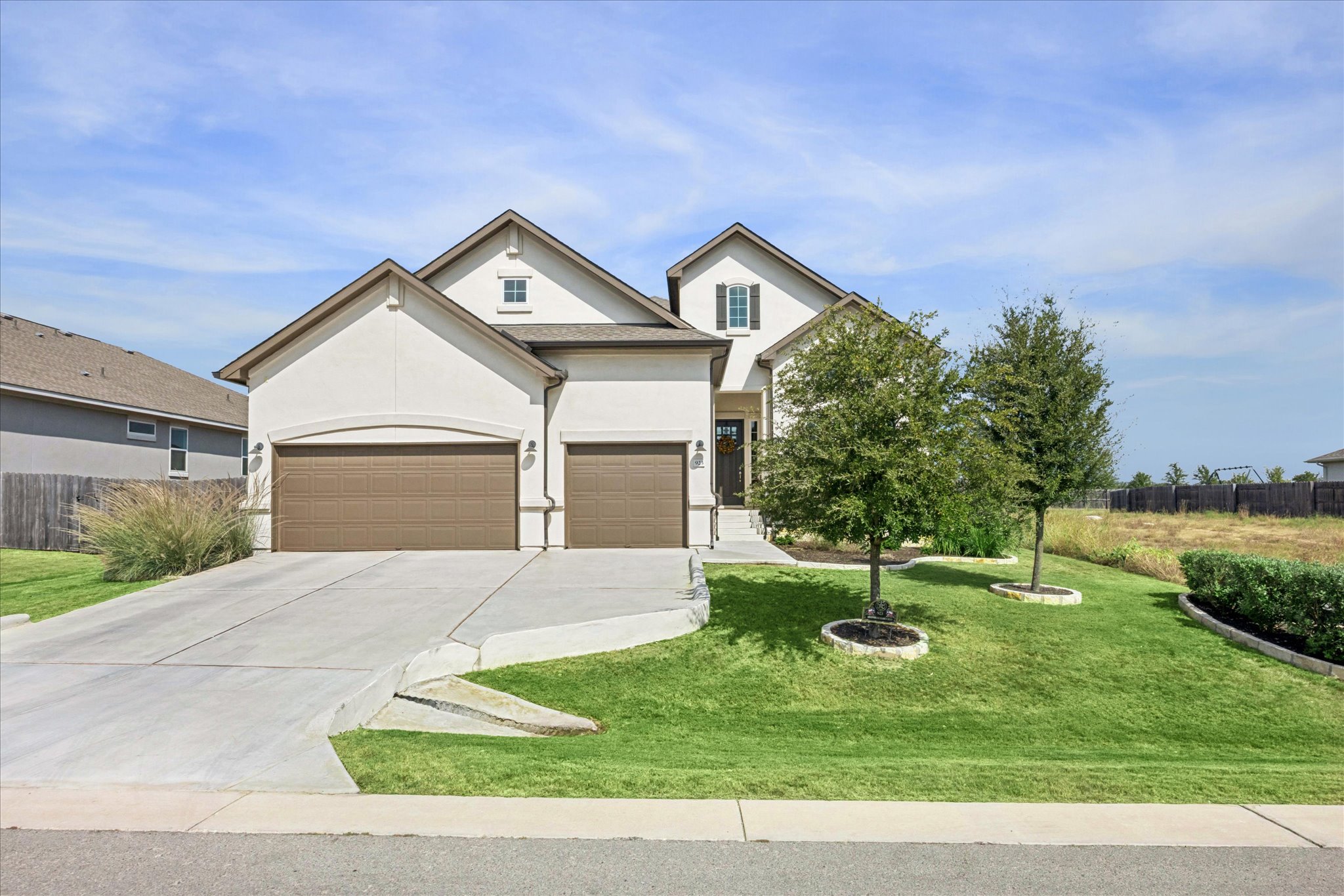 923 Arrowhead Ranch Boulevard Dripping Springs, TX 78620 - Photo 1 of 1 View of front of property with driveway, stucco siding, and 3-car garage