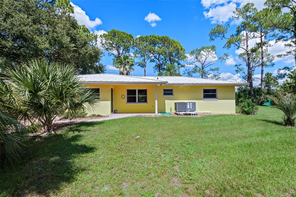37451 Beach Drive Umatilla, FL 32784 - Photo 1 of 1 a front view of a house with a garden
