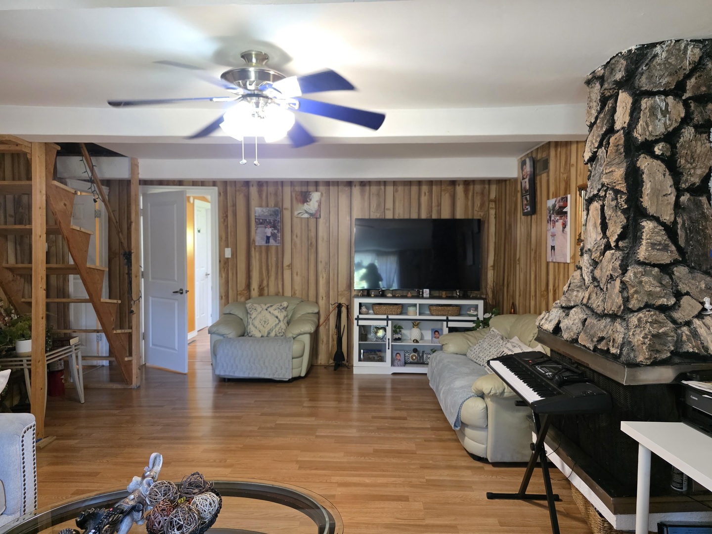 38433 North 5th Avenue Spring Grove, IL 60081 - Photo 17 of 44 a living room with furniture and a flat screen tv