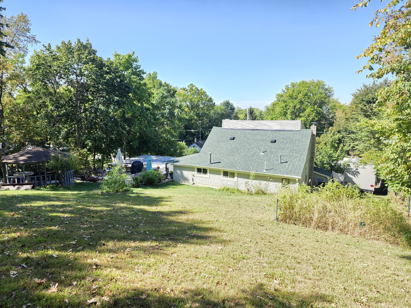 38433 North 5th Avenue Spring Grove, IL 60081 - Photo 40 of 44 a view of a house with a yard and a large tree