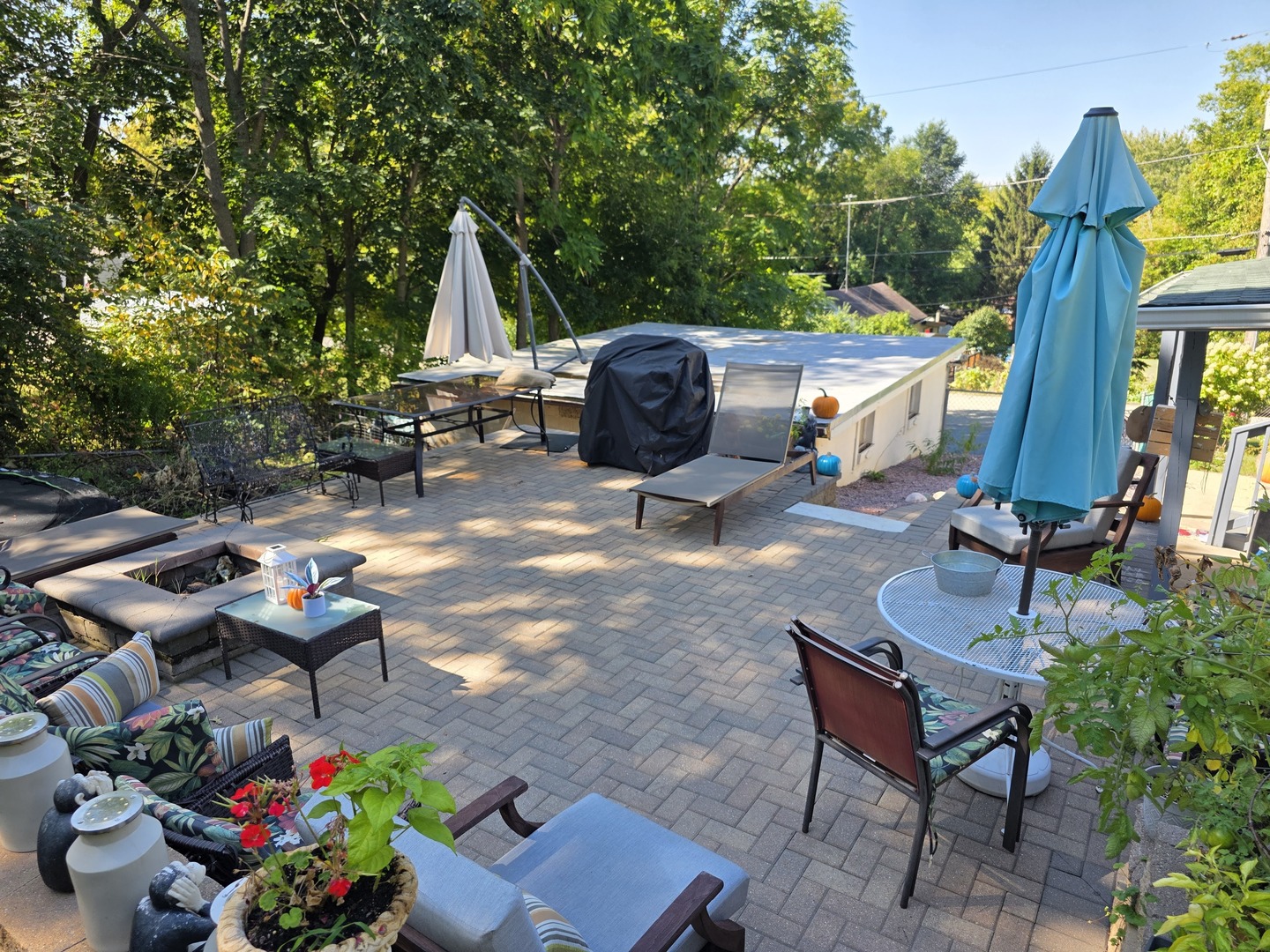 38433 North 5th Avenue Spring Grove, IL 60081 - Photo 4 of 44 a backyard of a house with barbeque oven table and chairs