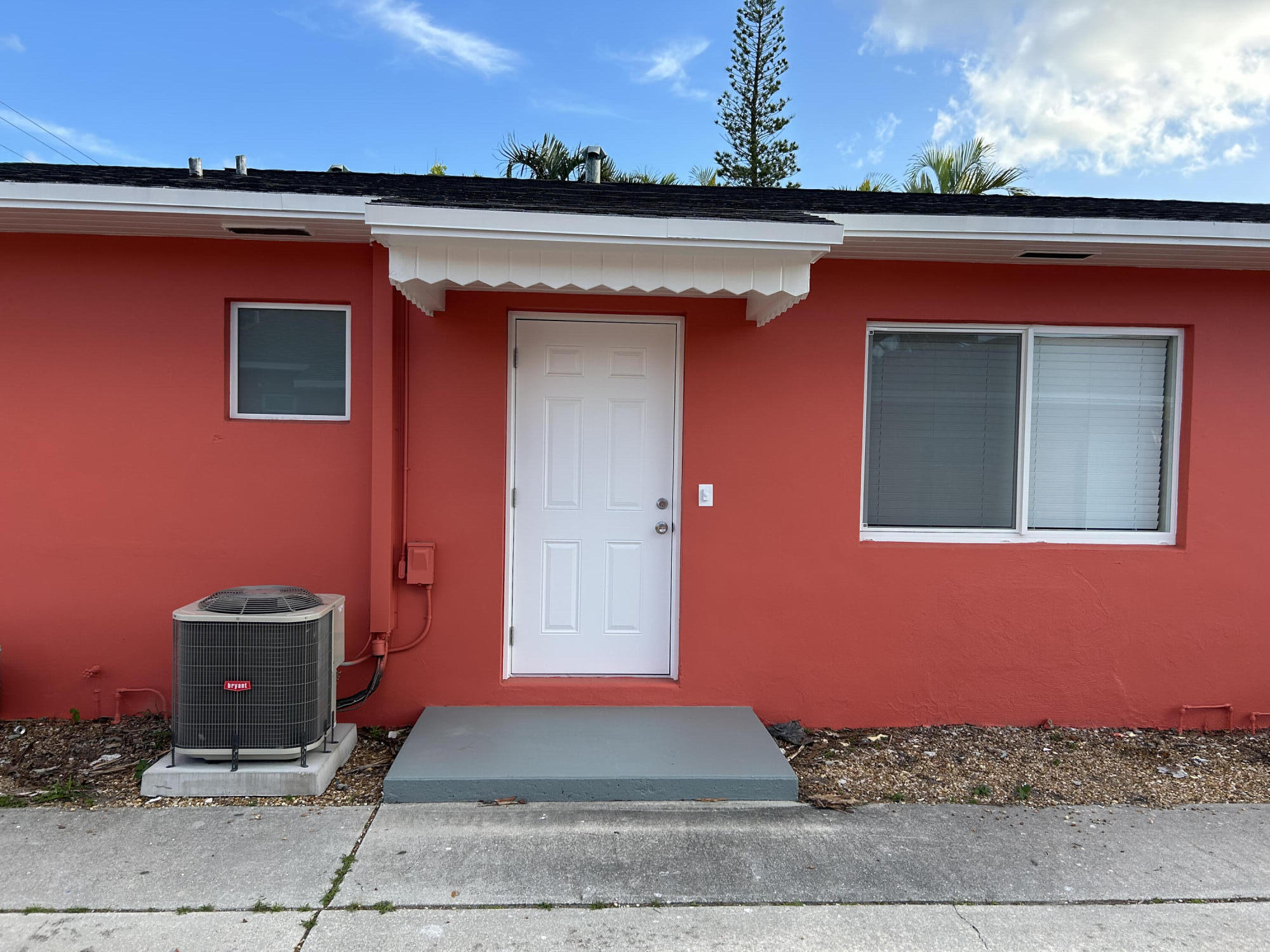 622 North M Street, Unit 3 Lake Worth Beach, FL 33460 - Photo 2 of 9 a front view of a house with a yard