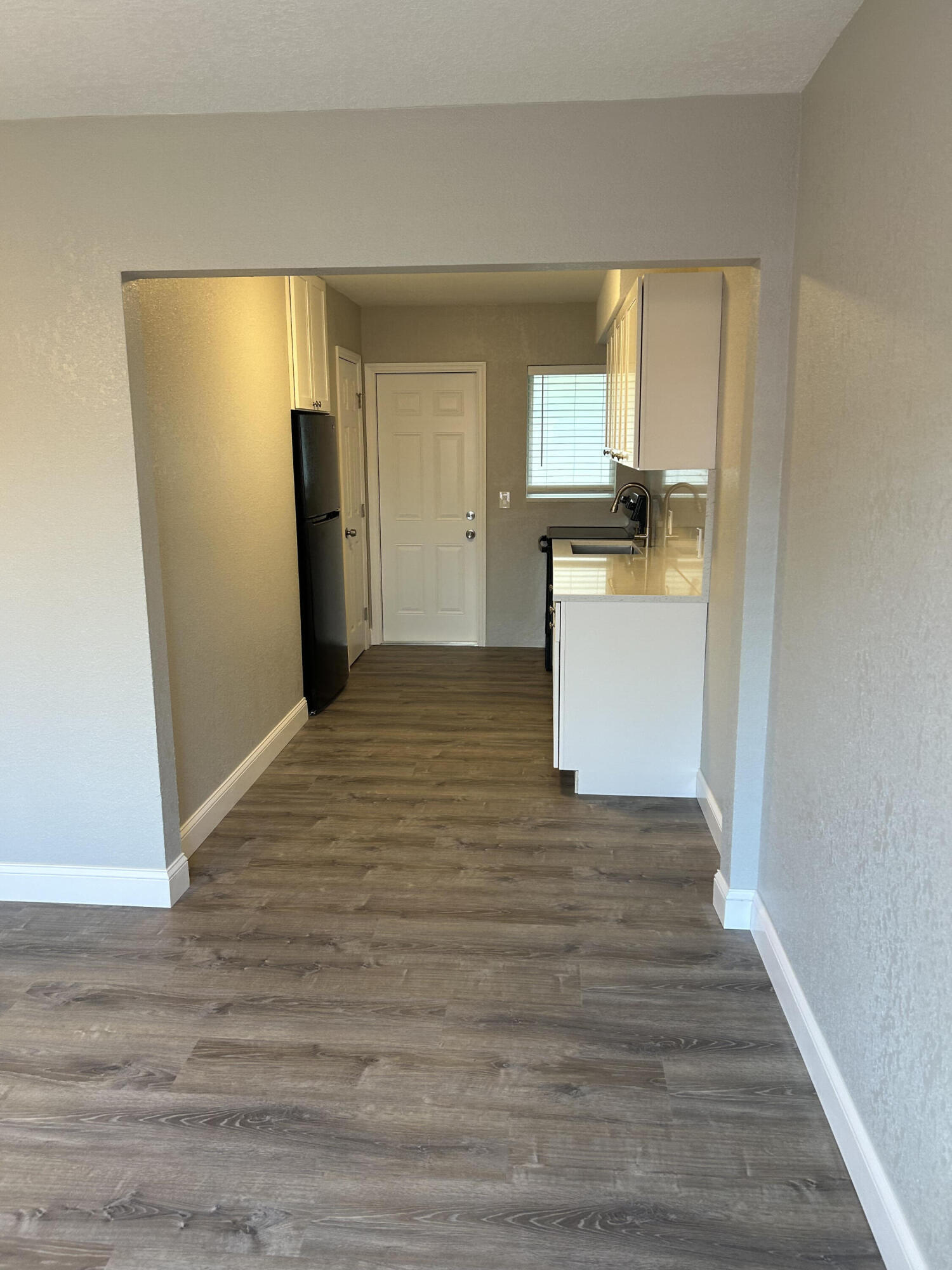 622 North M Street, Unit 3 Lake Worth Beach, FL 33460 - Photo 4 of 9 a view of a kitchen from the hallway