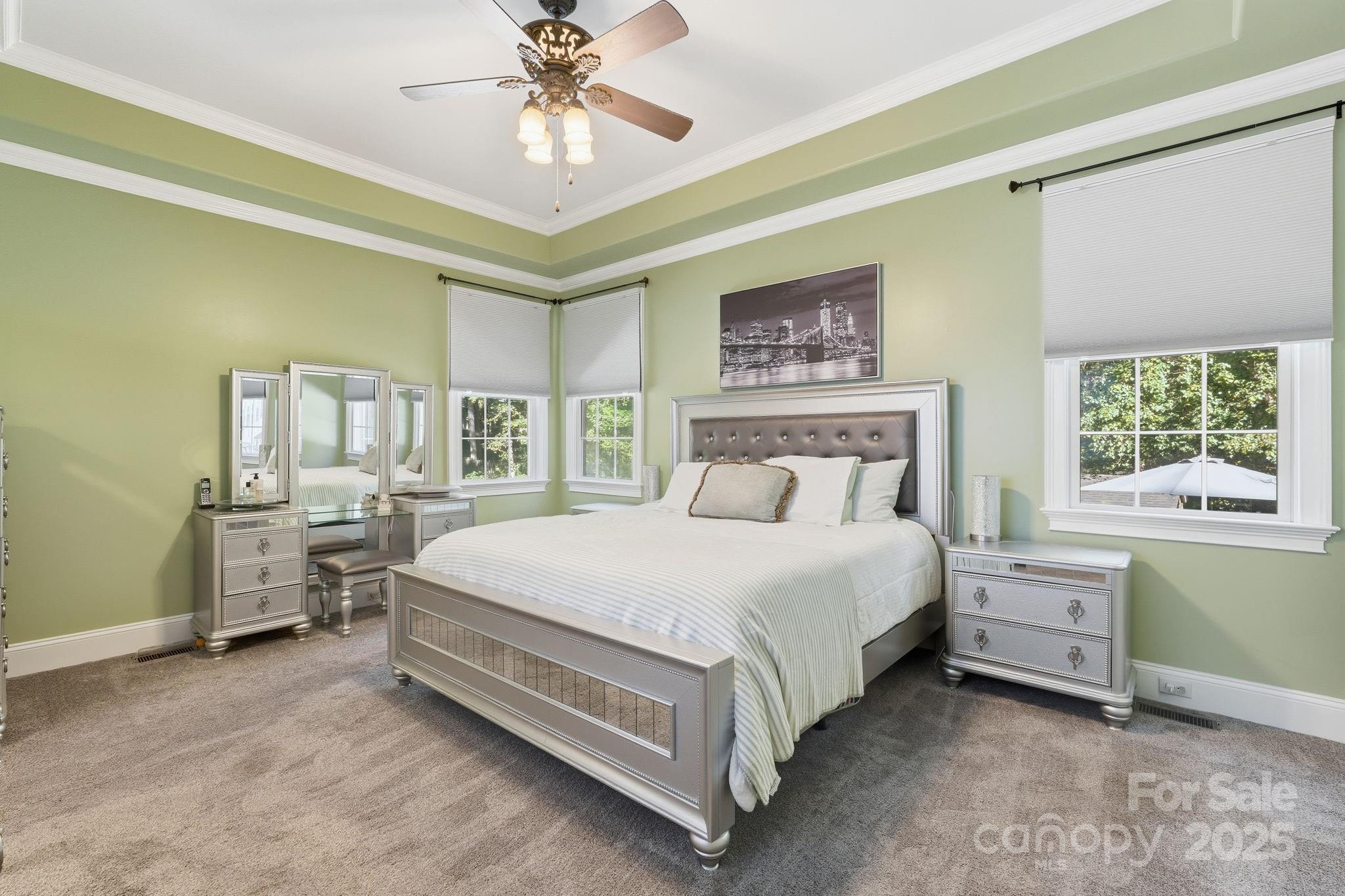 405 St Andrews Road Statesville, NC 28625 - Photo 11 of 37 a bed room with a bed and a chandelier
