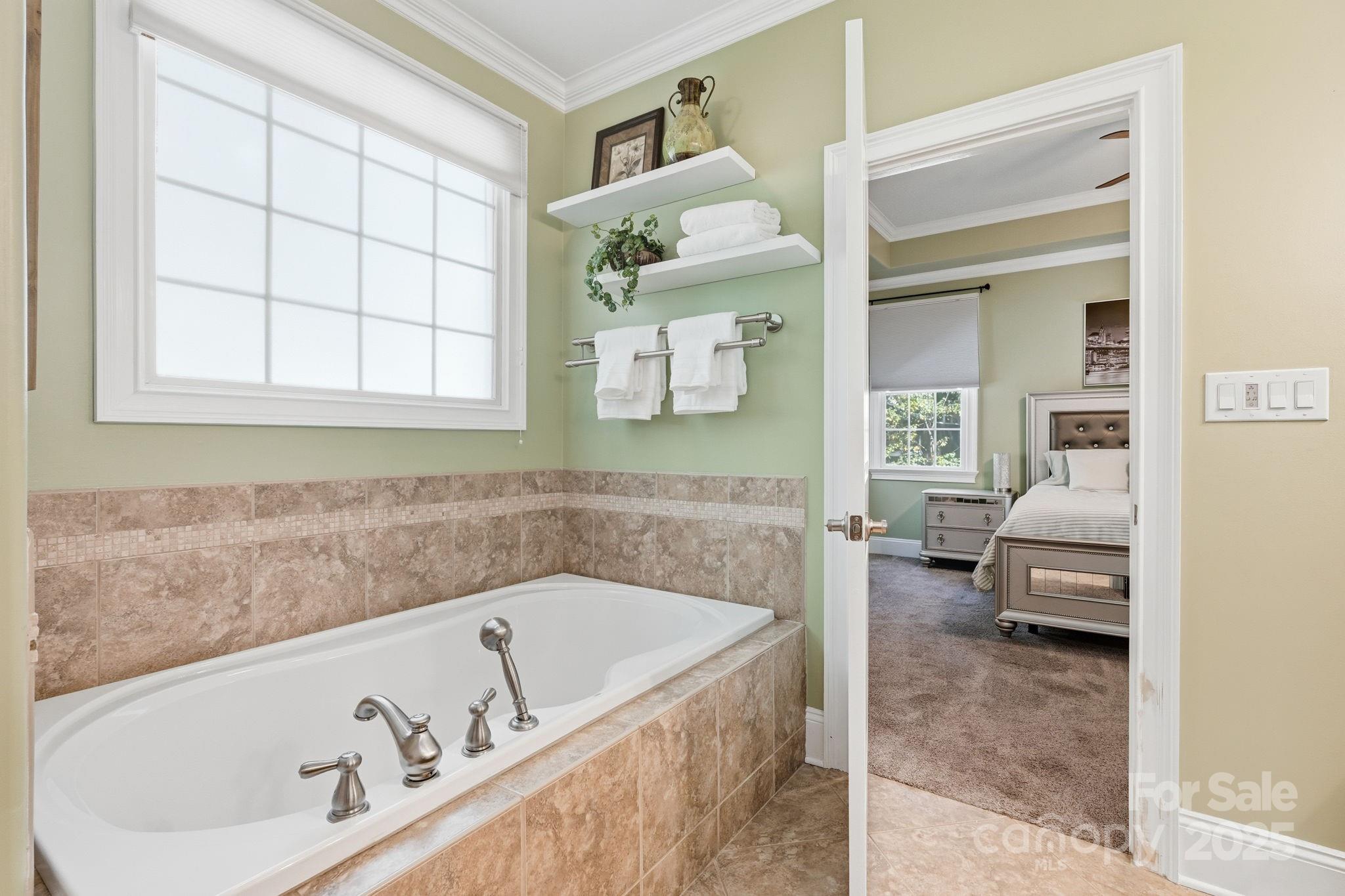 405 St Andrews Road Statesville, NC 28625 - Photo 13 of 37 a bath tub sitting in a bathroom next to a window