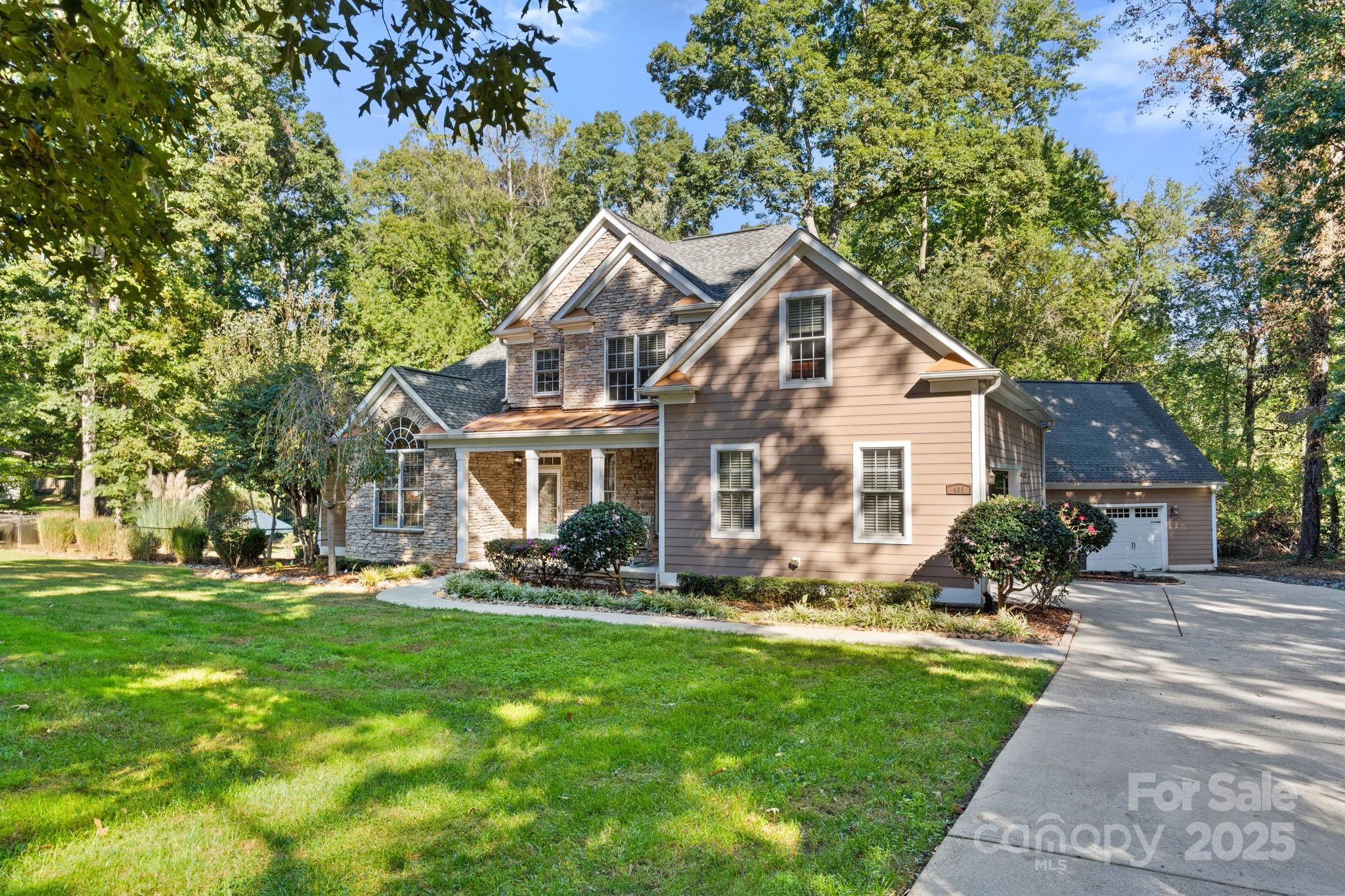 405 St Andrews Road Statesville, NC 28625 - Photo 2 of 37 a front view of a house with a yard