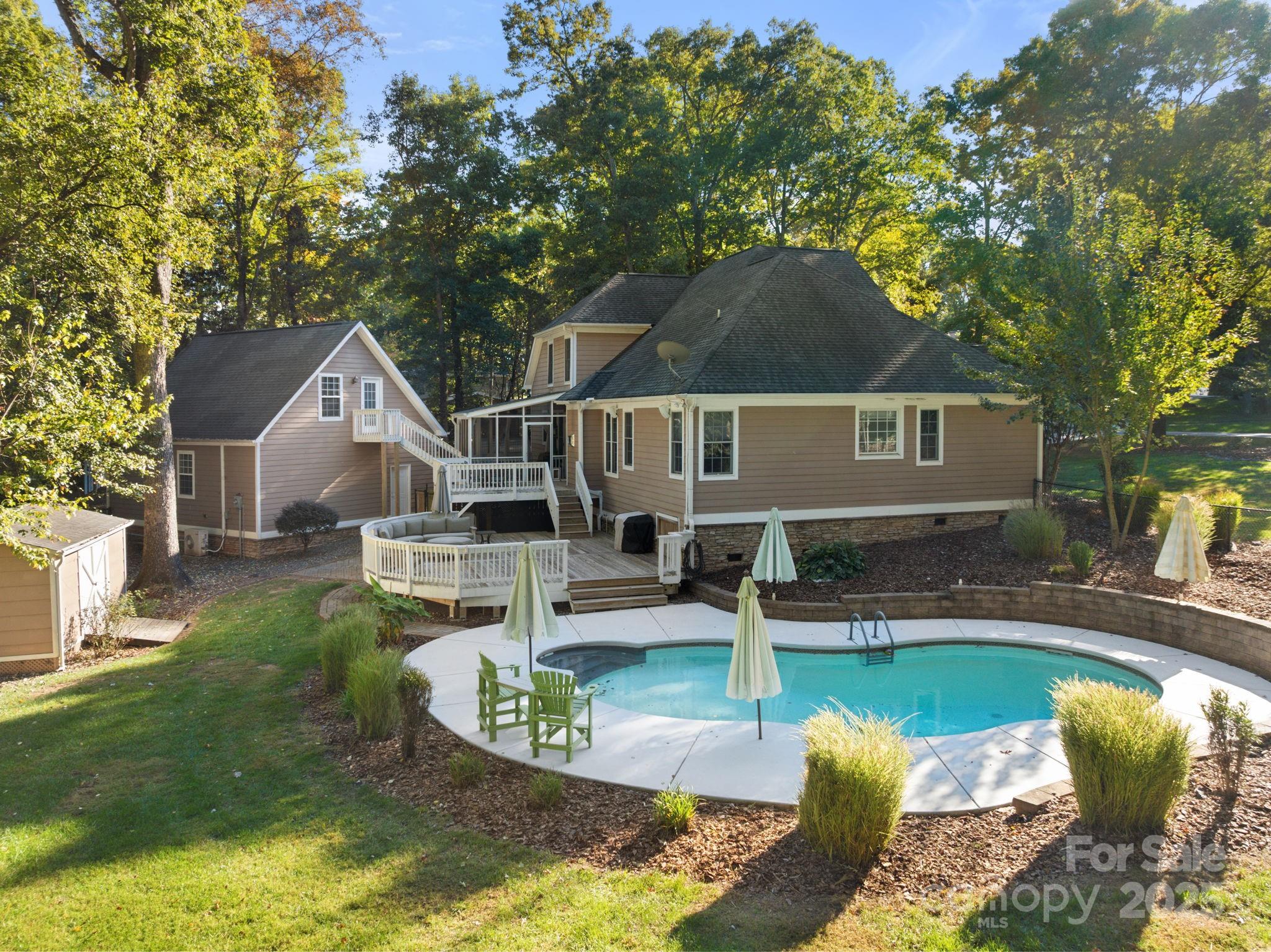 405 St Andrews Road Statesville, NC 28625 - Photo 23 of 37 a aerial view of a house with swimming pool and a yard