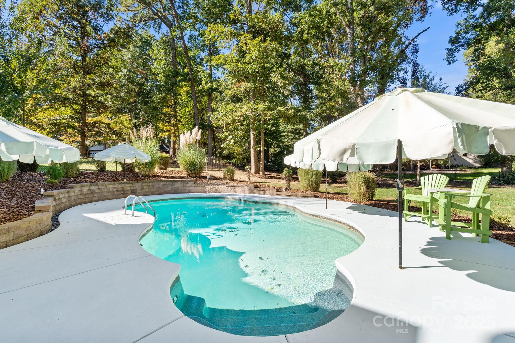405 St Andrews Road Statesville, NC 28625 - Photo 27 of 37 a view of a swimming pool with a patio