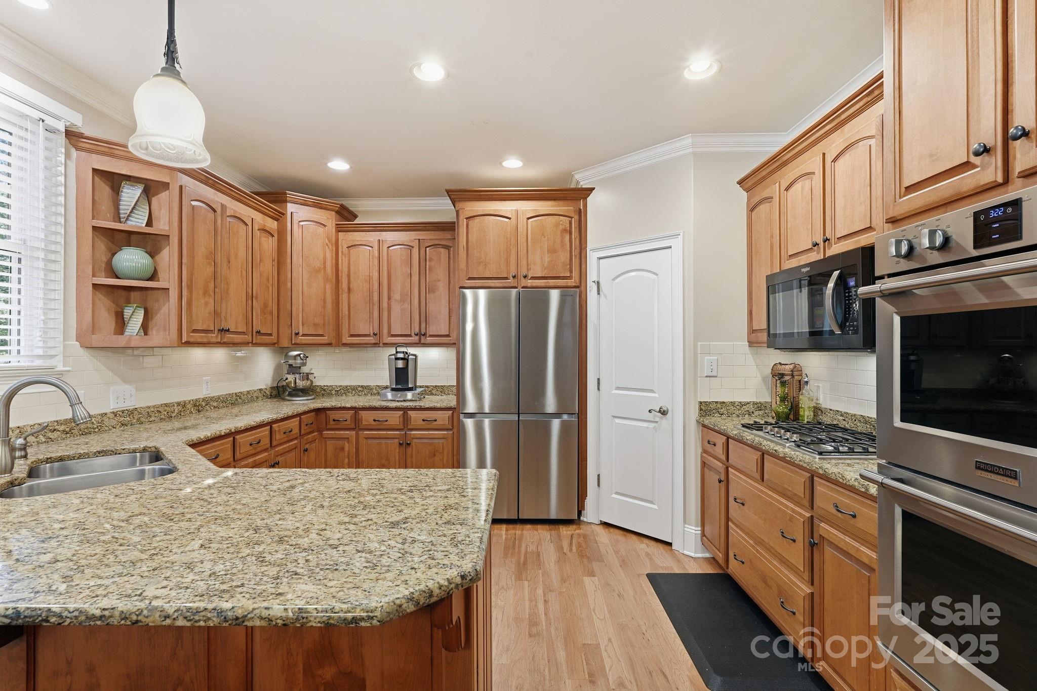 405 St Andrews Road Statesville, NC 28625 - Photo 7 of 37 a kitchen with stainless steel appliances granite countertop a refrigerator stove and sink