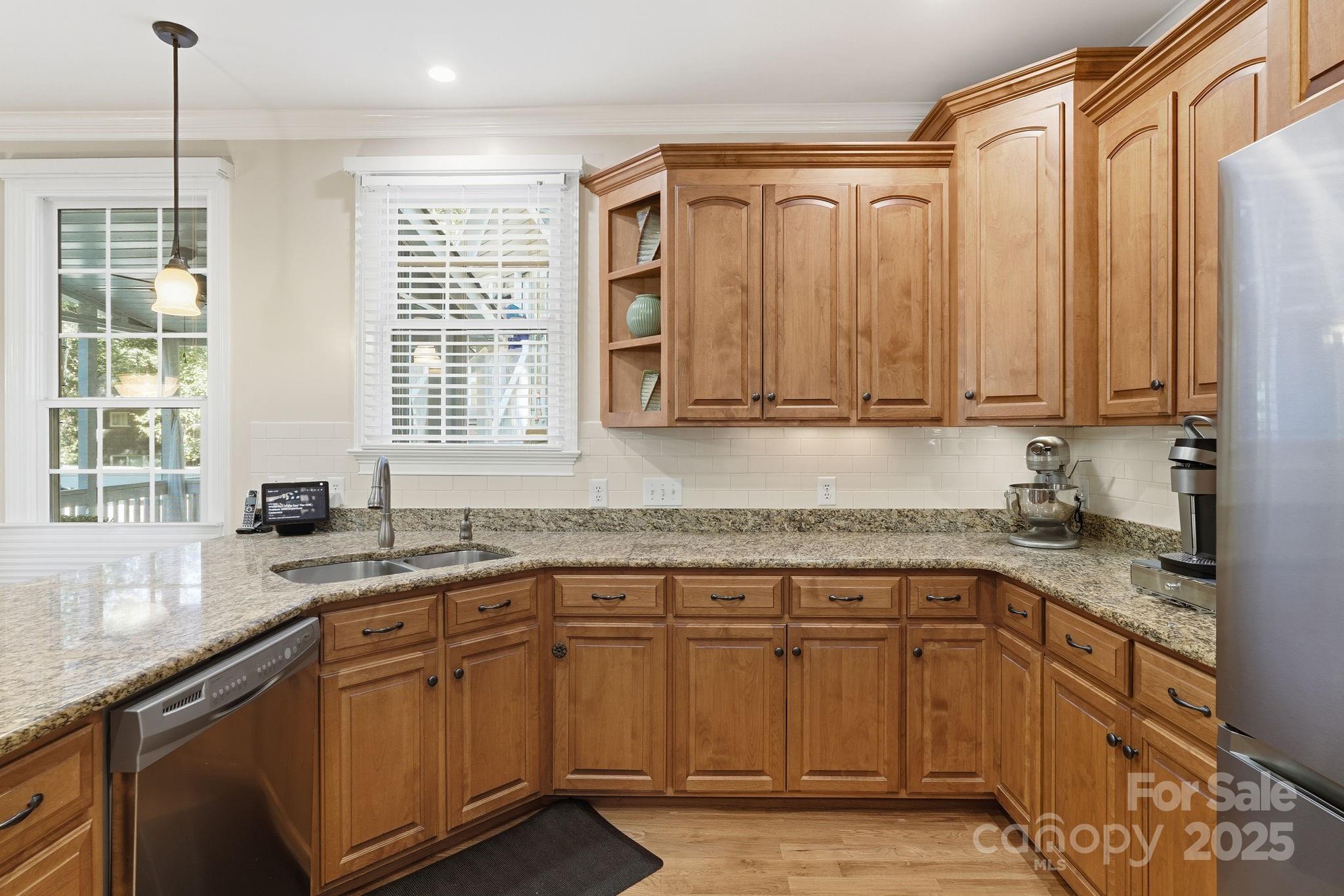 405 St Andrews Road Statesville, NC 28625 - Photo 8 of 37 a kitchen with stainless steel appliances granite countertop a sink a stove and cabinets