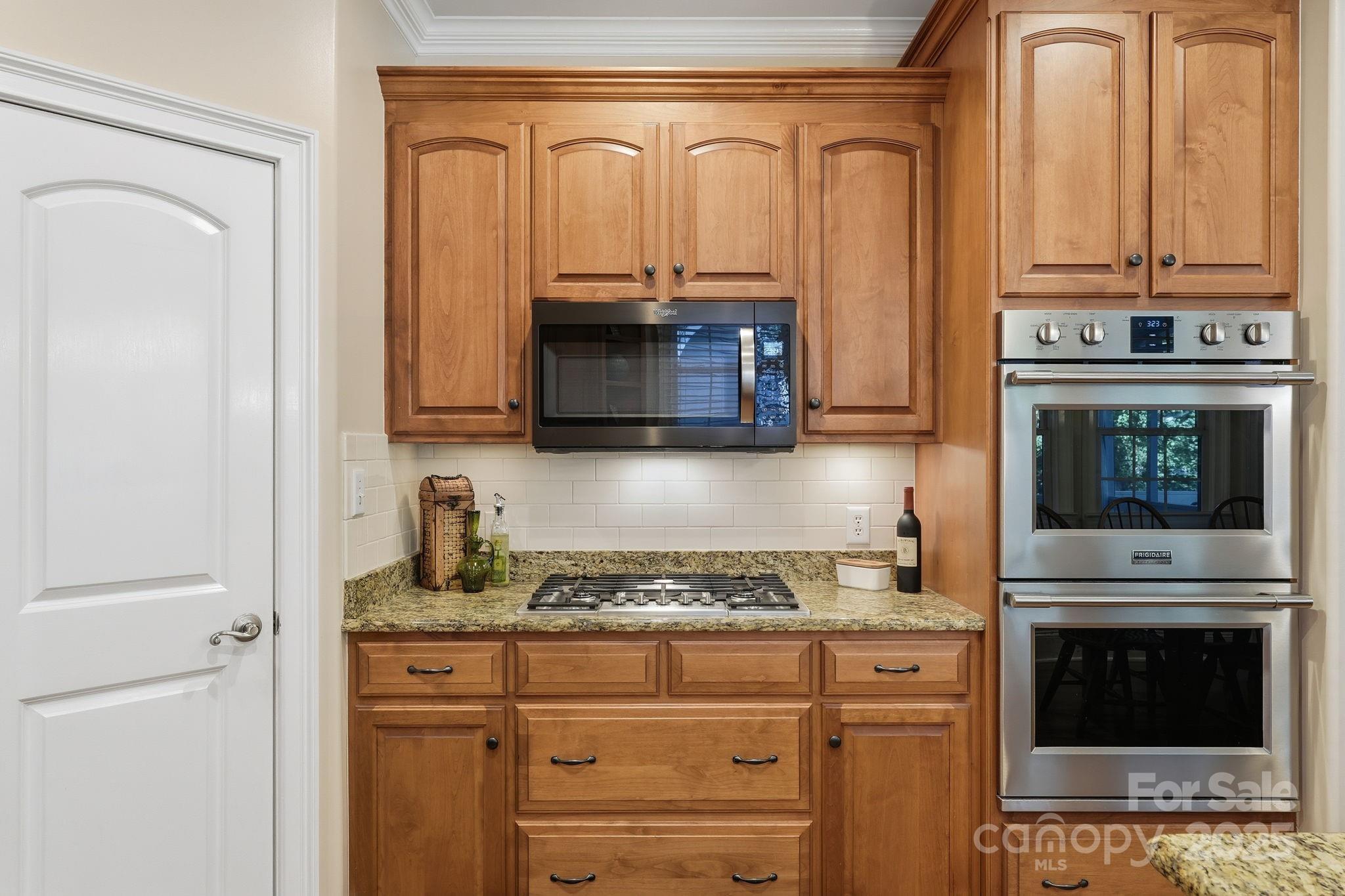 405 St Andrews Road Statesville, NC 28625 - Photo 9 of 37 a kitchen with stainless steel appliances granite countertop a stove and a microwave
