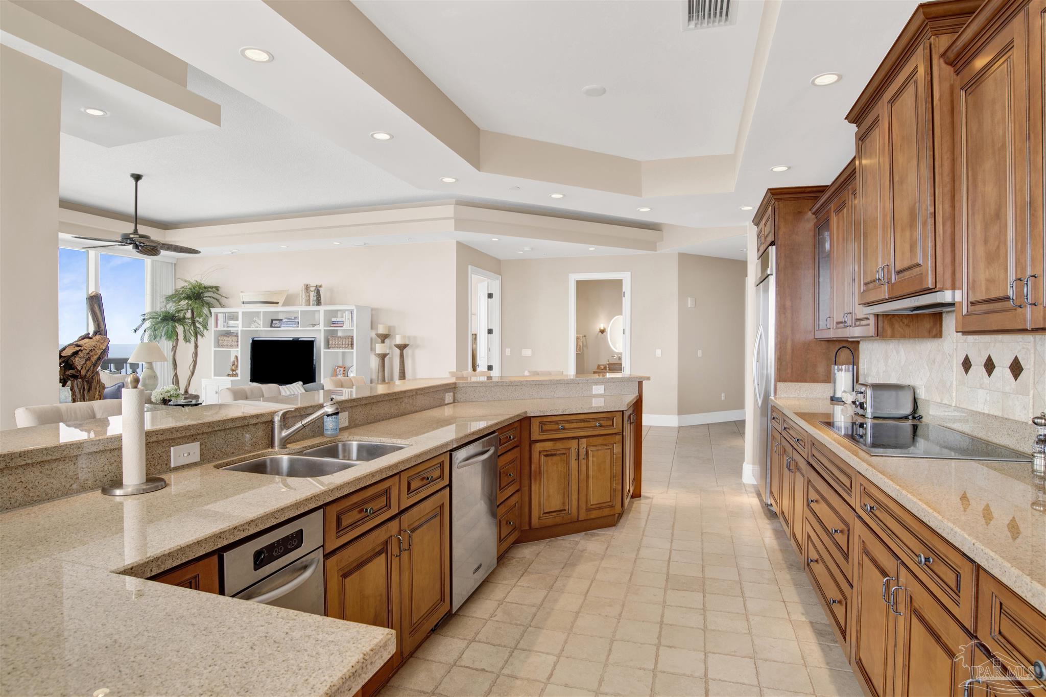14455 Perdido Key Drive, Unit 601 Perdido Key, FL 32507 - Photo 13 of 62 a large kitchen with kitchen island a sink stainless steel appliances and cabinets