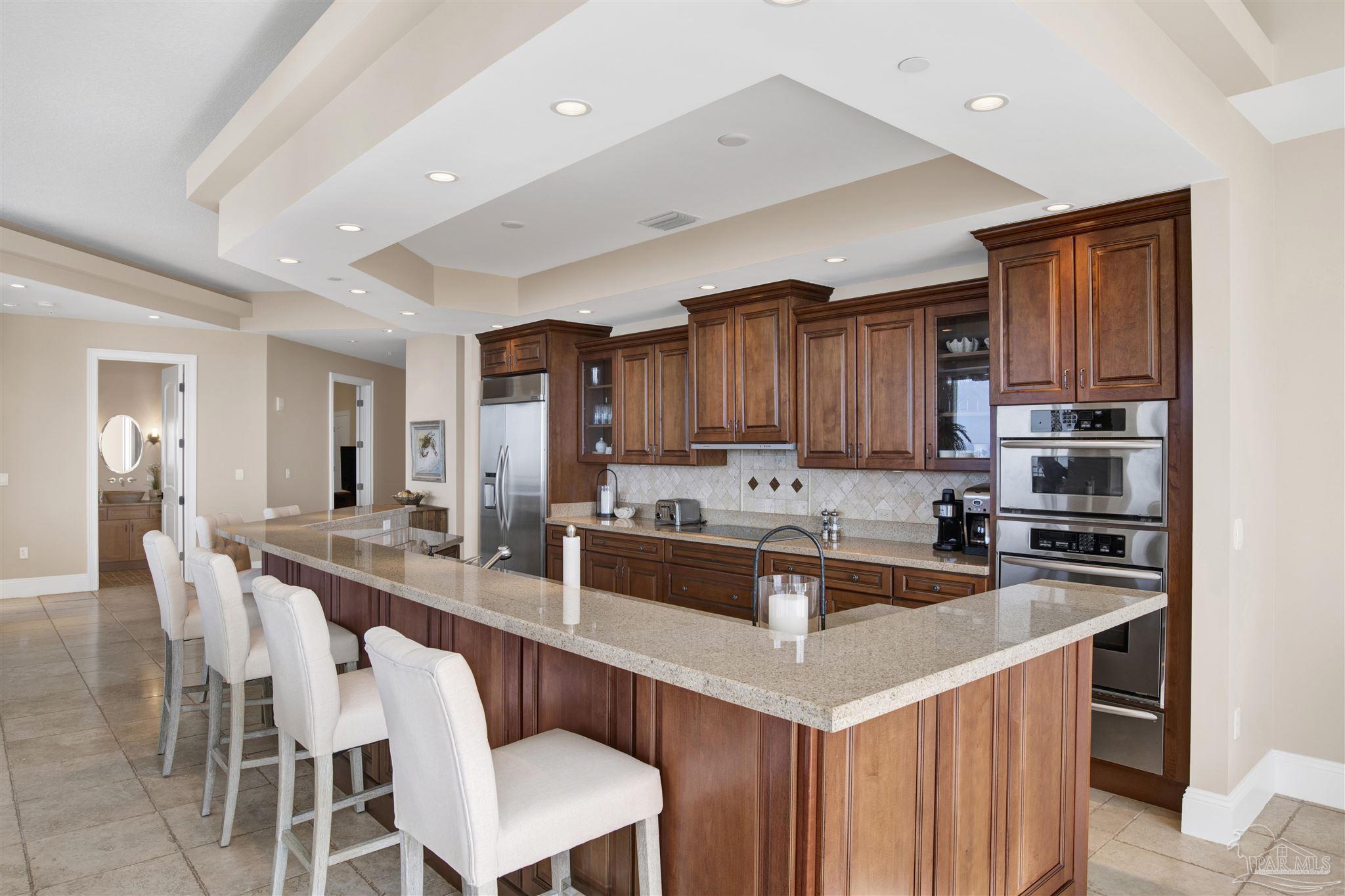 14455 Perdido Key Drive, Unit 601 Perdido Key, FL 32507 - Photo 14 of 62 a kitchen with a sink a counter top space stainless steel appliances and cabinets