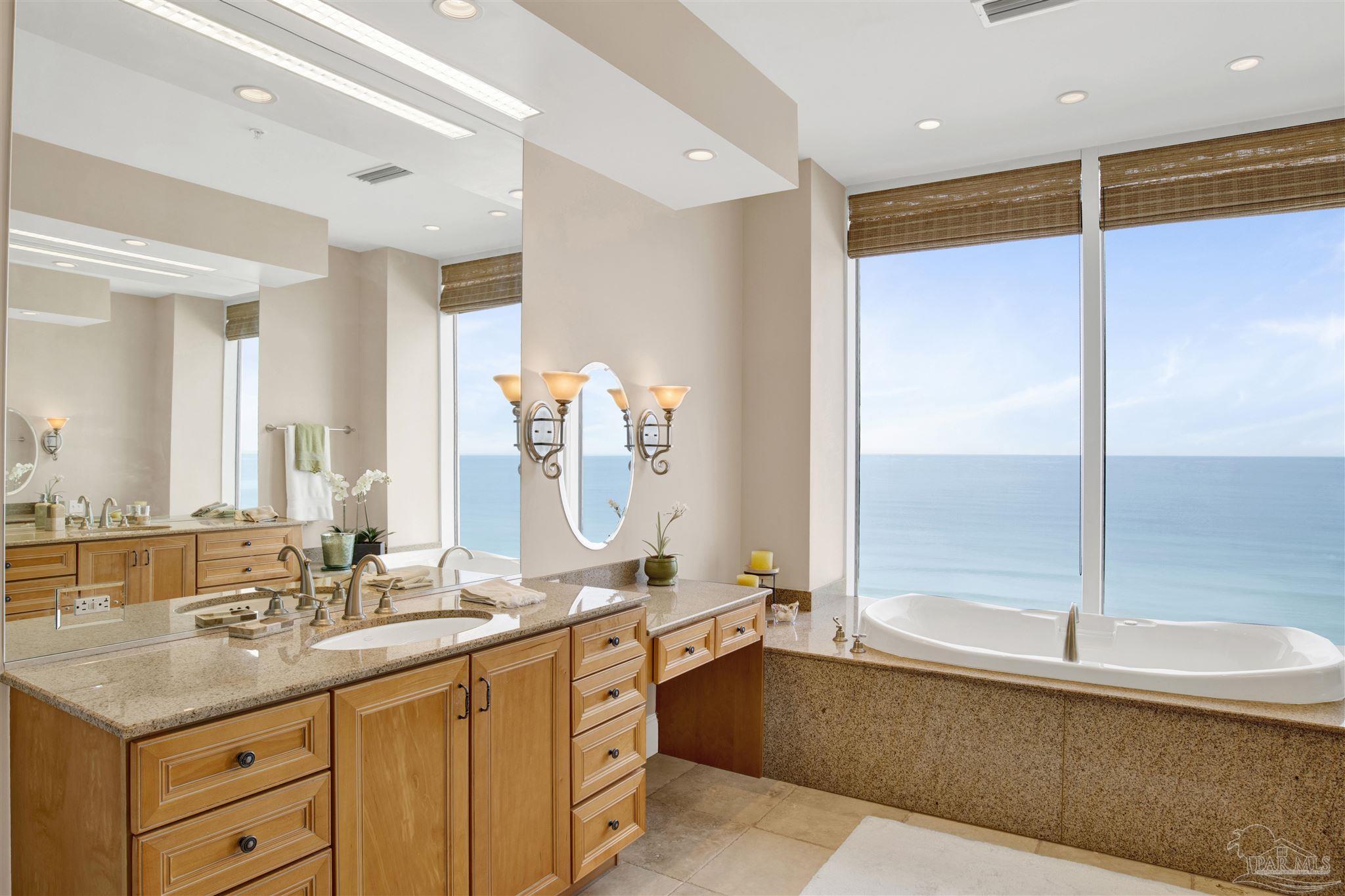 14455 Perdido Key Drive, Unit 601 Perdido Key, FL 32507 - Photo 24 of 62 a bathroom with a double vanity sink and a mirror
