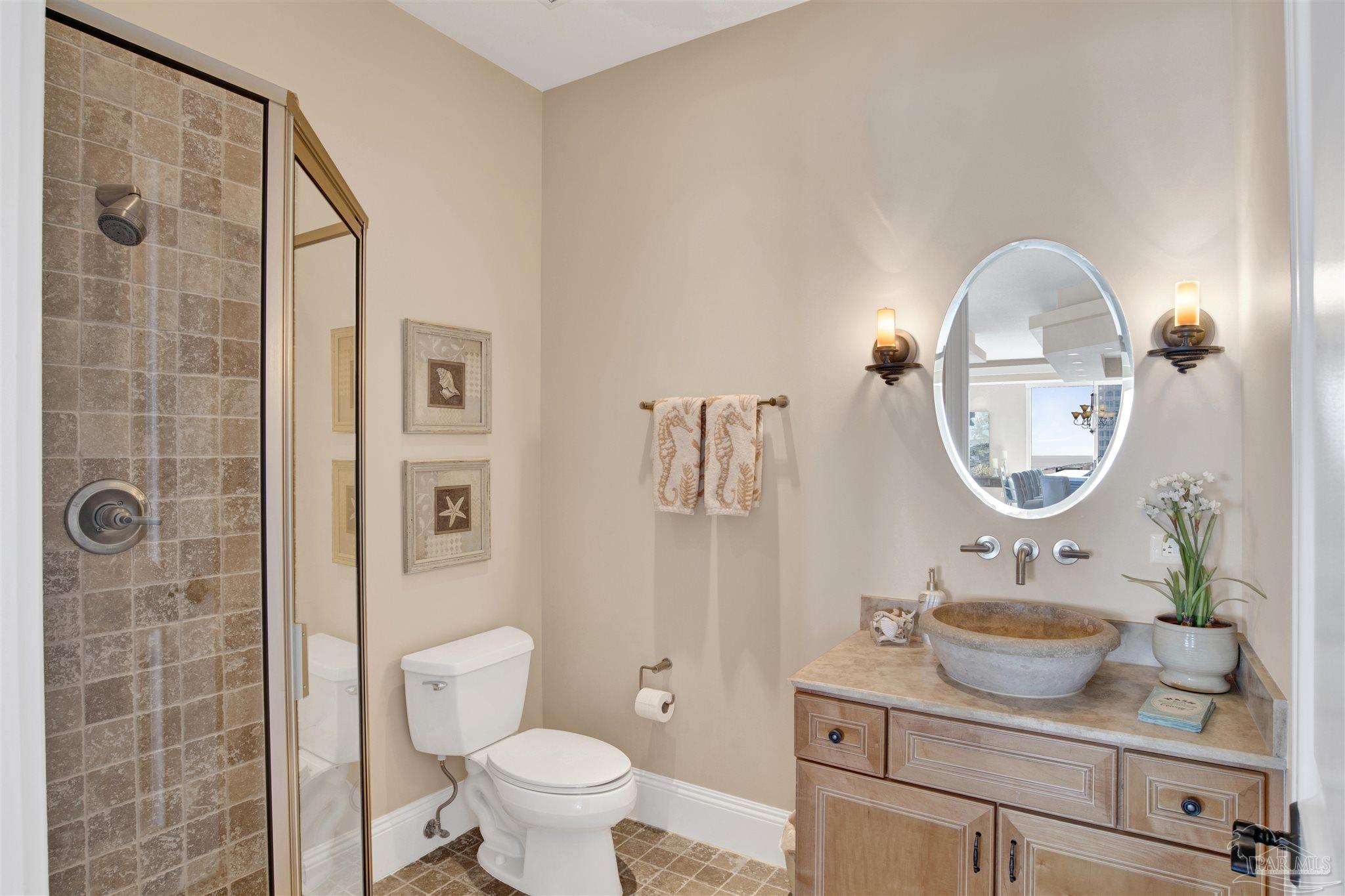 14455 Perdido Key Drive, Unit 601 Perdido Key, FL 32507 - Photo 27 of 62 a bathroom with a toilet sink and mirror