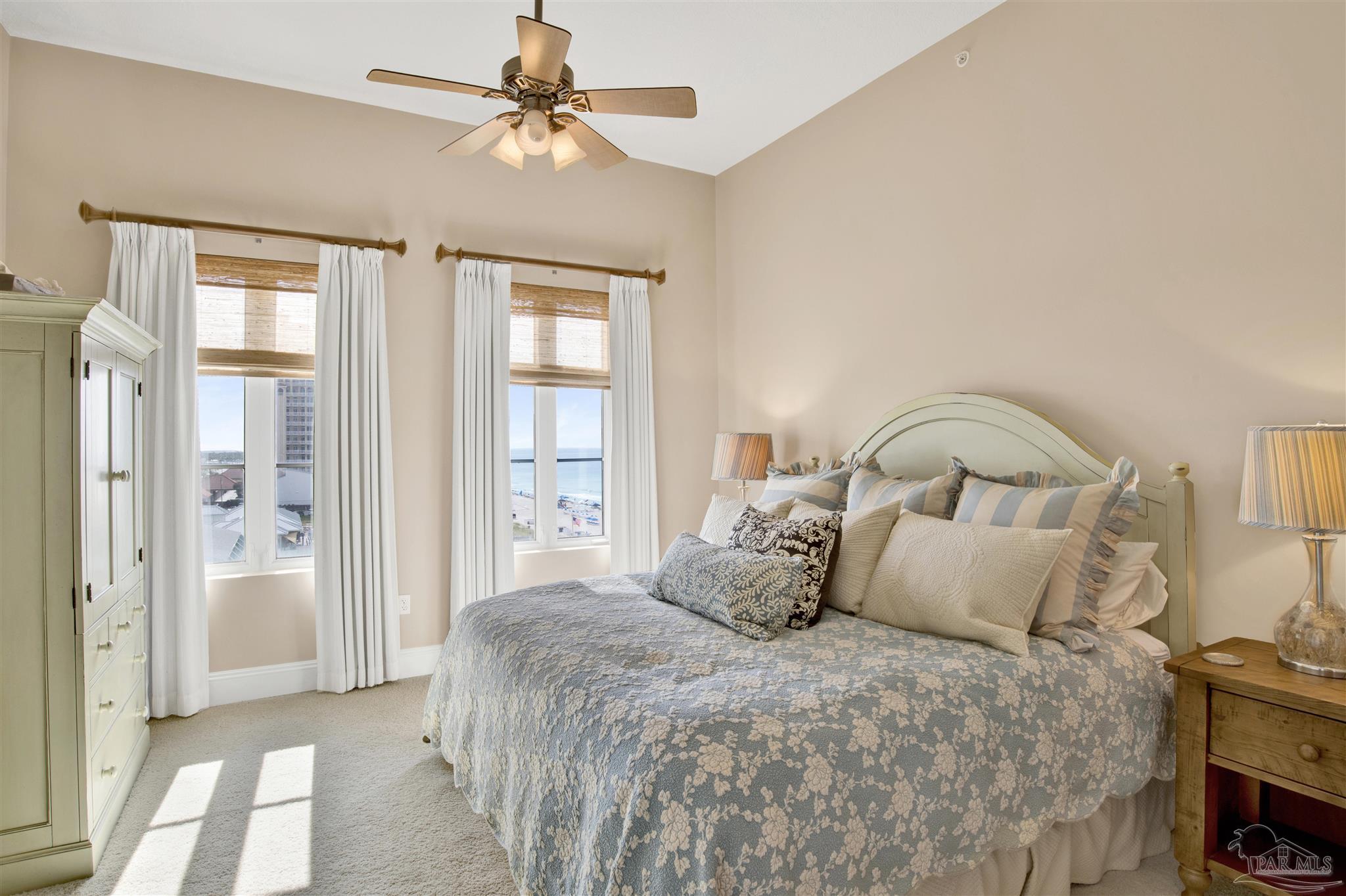 14455 Perdido Key Drive, Unit 601 Perdido Key, FL 32507 - Photo 32 of 62 a bedroom with a bed and a chandelier