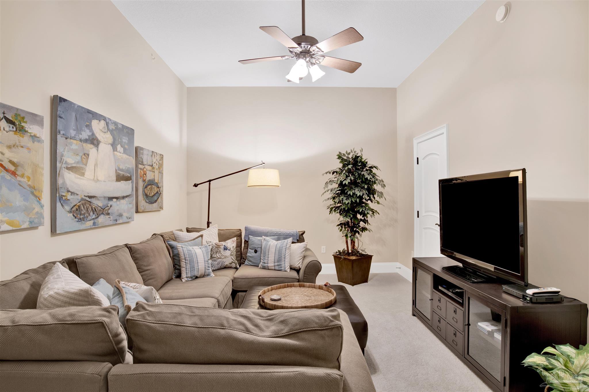 14455 Perdido Key Drive, Unit 601 Perdido Key, FL 32507 - Photo 36 of 62 a living room with furniture and a flat screen tv
