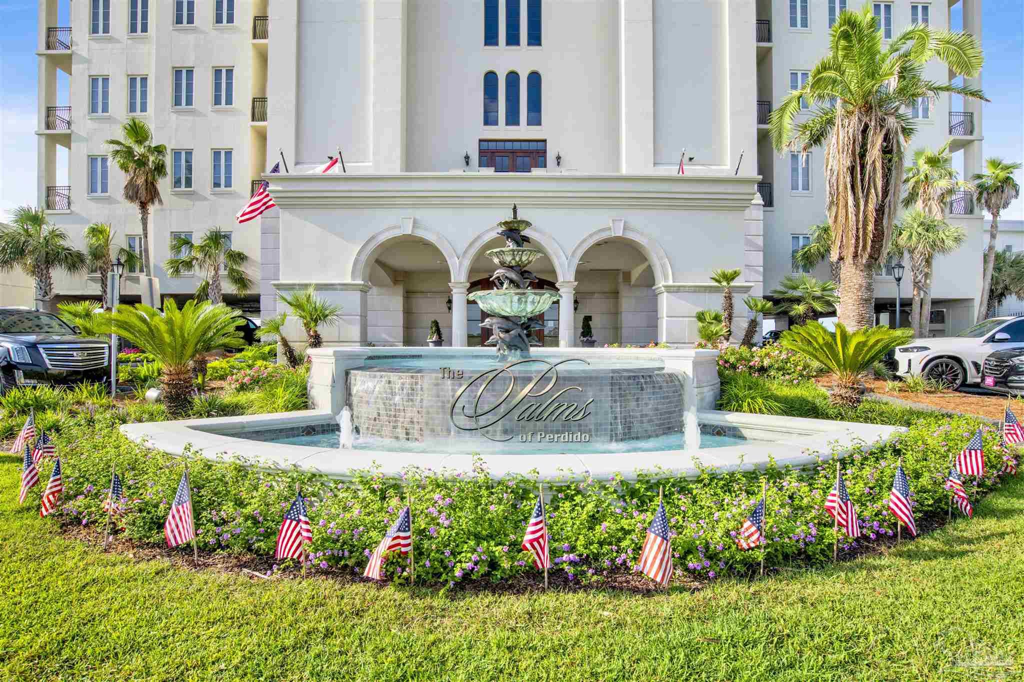 14455 Perdido Key Drive, Unit 601 Perdido Key, FL 32507 - Photo 37 of 62 a front view of a multi story residential apartment building with a yard