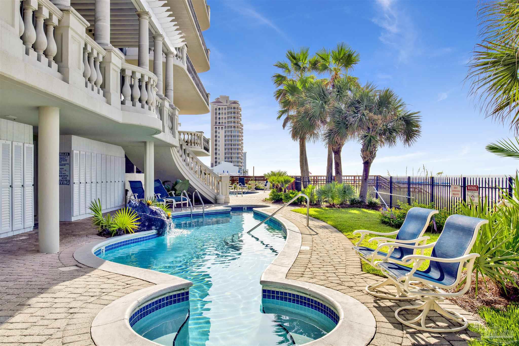 14455 Perdido Key Drive, Unit 601 Perdido Key, FL 32507 - Photo 40 of 62 a view of a swimming pool with a lounge chairs