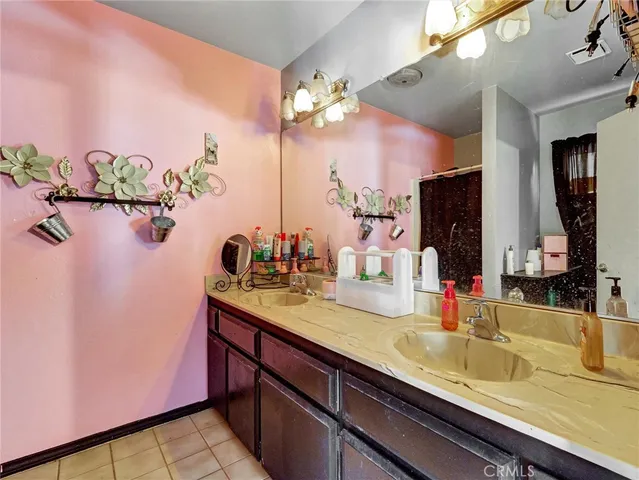 a bathroom with a sink a vanity and a mirror