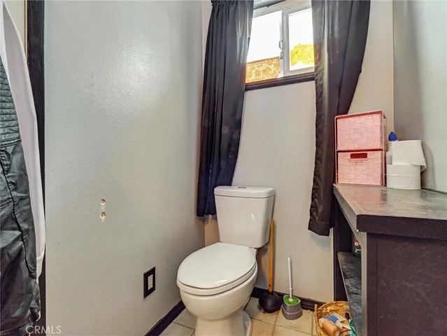 a white toilet sitting next to a sink