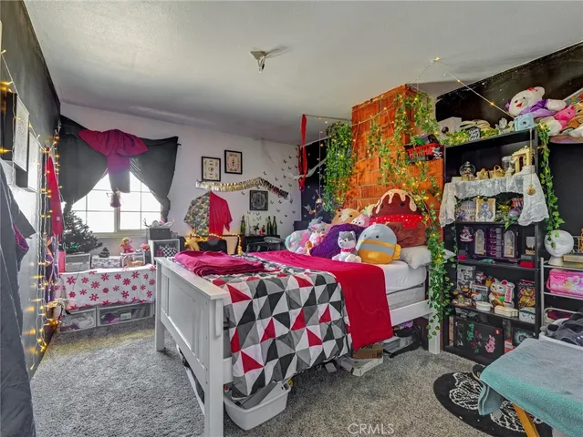 a bedroom with bed and a window